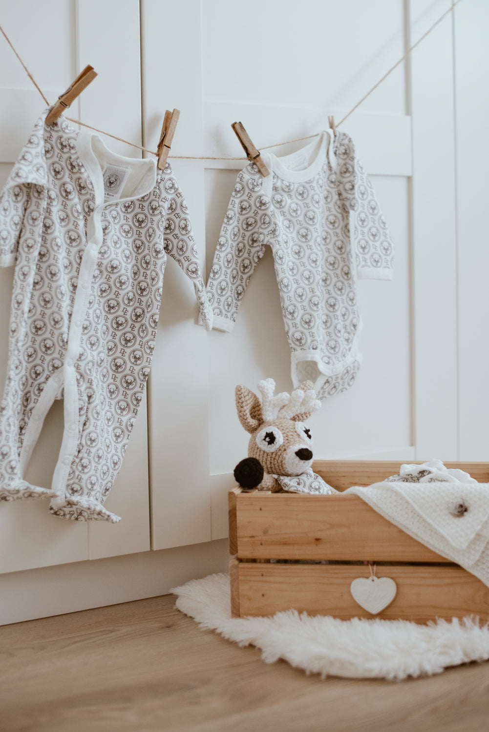 Snap-up footed coverall with Dear Eco logo